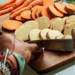 sliced carrots on brown wooden chopping board